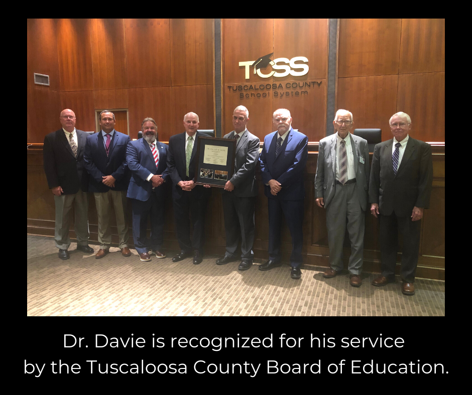 Photo of Board members making presentation to Dr. Davie. Photo of Board members making presentation to Dr. Davie.